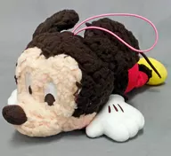 "Mickey and Friends", a Plush toy with Mickey Mouse's red cheeks lying on the floor.