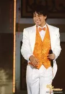 Johnny's West / Terufumi kiriyama / Live Photo / Above Knee / Costume White / Orange / Bow Tie / Face Left Facing / Left Hand Microphone / Background Black / Typhoon N Dreamer