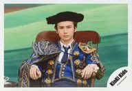 KinKi Kids / Koichi Domoto / Horizontal, upper body, sitting, costume blue, gold, cap black, two hand chair, background green / 『 rose and sun 』 PV photo / Official Official photo