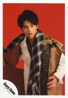 SeXyzone / Katsutoshi Satō / Upper Body / Sitting / Right Hand Costume Beige / White / Red / Stole Black / White Check Pattern / Eye View Right / Background Red / Official Official photo