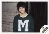 Johnnys Jr. / Genta Matsuda / horizontal, upper body, costume green, shirt yellow, letter "M", smile, logo "Johnny's OSAKA 2015.4.4 RENEWAL OPEN" / Johnnys Shop Osaka Store Limited Time Official Official photo