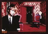 Nightmare / Sakito / Horizontal, Corpo superior, Traje preto, Linha de visão direita, Fundo vermelho, Logotipo "SHOXX" / Foto oficial ao vivo