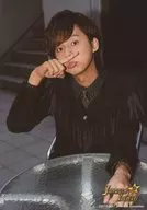 Kis-My-Ft2 / Taisuke Fujigaya / Bust up, sitting, costume black, tie, polka-dot pattern, right hand finger, under nose, left hand table / "JOHNNYS' ALLSTARS ISLAND" original photo