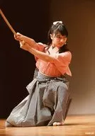 Sakura Gakuin / Marin Hidaka / Live Photo, Whole Body, Sitting, Costume Pink, Striped Pattern, Hakama, Both Hands Wooden Swords, Body Facing Right / "Sword Dance Lesson 2" Lesson Stage ver. Photo Set