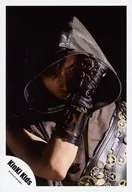 KinKi Kids / Koichi Domoto / Bust up / Costume black / Gear / Hood cover / Right hand raised face front / Eye line right / Right eye hidden / Background black / Official Official photo