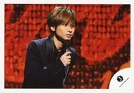 Kinki Kids / Koichi Domoto / Horizontal, Upper Body, Costume Black, Right Hand Microphone, Body Facing Right, Background Red, Black / Official Official photo