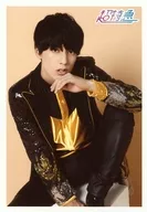 Super Express / Yusuke / Knee-High / Costume black / yellow / Sitting / Left knee raising / Left chin / Background beige / Official photo Vol. 59