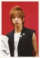 NEWS / Keiichiro Koyama / Bust up / no sleeve Costume black / Inner white / Background red / Official Official photo