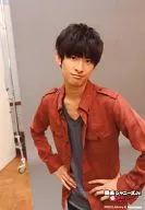 Kansai Johnnys Jr. / Yasuji Mukai / Upper body, costume red / grey, both hands waist, background grey and logo "Kansai Johnnys Jr. First National Tour 2013" / Official Official photo