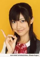 Berryz Kobo / Yurina Kumai / Bust Up / Costume Gray / White / Ribbon Red / Right Hand Index Finger Standing / Thumb Middle Finger Round / Background Yellow / Official Official photo