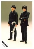 KinKi Kids / Domoto Go ・ Domoto Koichi / Whole Body ・ Costume Black ・ Left Hand "J" ・ Eye View Left ・ Arm Clasps ・ Background Grey / Official Official photo