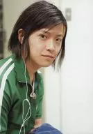 W-inds. / Ryuichi Ogata / upper body, green jersey, body facing right, earphones, no frame / official Official photo