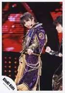 Kinki Kids / Koichi Domoto / Live photo, above knees, costume purple gold, Fukuda beside, background red, monitor / Official Official photo