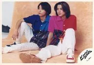 Kinki Kids / Koichi Domoto, Tsuyoshi Domoto / Horizontal, Whole body, Sitting, Costume blue, Red, Pants white, Background orange, Eye-point left / Official Official photo