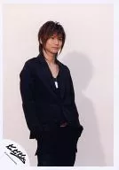 Kinki Kids / Koichi Domoto / Above-the-knee ・ Jacket black ・ Both hand pockets ・ Right facing ・ Necklace ・ Background beige / Official Official photo