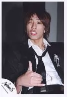 NEWS / Keiichiro Koyama / Upper body, sitting, jacket black, shirt white, fingers of the right hand standing, wink / Official Official photo