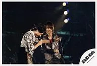 Kinki Kids / Domoto Go ・ Domoto Koichi / Horizontal ・ Live Photo ・ Waist Upper ・ Costume Gray Black Silver ・ Right Hand Microphone ・ Hard Right Hand Lift ・ Background Black / Official Official photo