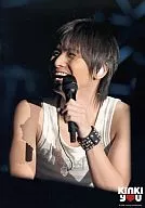 KinKi Kids / Koichi Domoto / Live photo, bust up, tank top white, left hand microphone, smile, black background, no frame, logo "KinKi you" / Kinki Kids Emergency Nationwide Tour KinKi you Concert.
