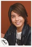 NEWS / Yuya Tegoshi / Bust up / Jacket black / Inner white / Necklace / Background orange / Smile / Official Official photo