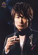 Shigeyuki Satō / Bust-up Jacket Black, Innerwear White, Right Hand Cigarette, Black Stole, Background Black / ThankCUE FAN MEETING 2008