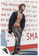 SMAP / Takuya Kimura / Whole body, upper body naked, jacket black, English background wall, left hand pocket / Official Official photo