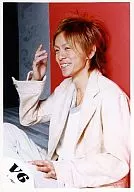 V6 / Takeshi Morita / Costume White, Left Facing, Sitting, Right Hand Raised, Background Red / Official Official photo