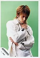 V6 / Jun' ichi Okada / Upper Body / Costume White / Inner Stripe White / Black / Right Hand Chest Front / Left Arm Stomach / Background Yellow Green / Official Official photo