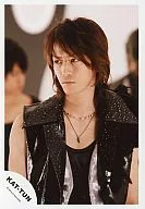 KAT-TUN / Kazuya Kamenashi / Bust up / Costume black / Sleeveless / Eyes left / People behind / Official Official photo