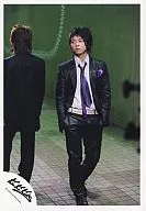 KinKi Kids / Domoto Go / Whole Body / Suit Black / Shirt White / Tie Purple / Both Hand Pockets / Light Next / Green Background / Official Official photo