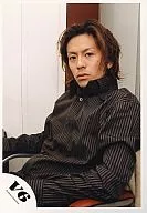 V6 / Tsuyoshi Morita / Upper body / Shirt black / Striped pattern / Sitting in a chair / Body facing left / Camera view / Official Official photo