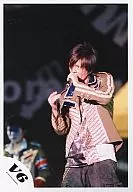 V6 / Takeshi Morita / Live Photo / Above the Knee / Costume Gray Beige Silver Metallic / Left Hand Microphone / Right Hand Raised / Background Black / Official Official photo