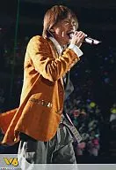 V6 / Takeshi Morita / Live Photo, Above Knee, Orange Jacket, Gray Pants, Body Facing Right, Right Hand Microphone, Background Black, Audience / Johnny's Web