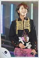 KAT-TUN / Kazuya Kamenashi / above knees / left hand microphone / right hand stomach / pants pink / smile / official Official photo