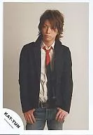 KAT-TUN / Kazuya Kamenashi / above knees / background white / jacket black / both hand pockets / tie red / black / official Official photo