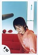 V6 / Takeshi Morita / Upper body / Orange hoodie / Light blue background / Red sofa / Under eyes / Official Official photo