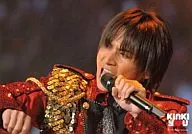 KinKi Kids / Koichi Domoto / "KinKi you" with live photo, horizontal, upper body, costume red, gold, left hand microphone and logo / Kinki Kids Emergency Nationwide Tour KinKi you Concert.