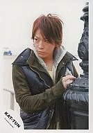 KAT TUN / Kazuya Kamenashi / upper body / camouflage jacket / black vest / black objet on the right