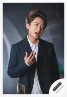 Arashi / Satoshi Ohno / Upper body / Costume black / white / Right hand raised / Mouth opened / Neck tilted / Right facing / Background black / Single "BRAVE" MV & Jacque-shot off-shot / Official Official photo