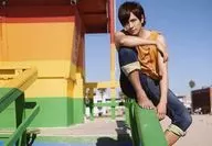 Takuma Zaiki / Horizontal, Whole Body, Sitting, Costume Orange, Tank Top, Right Hand Bending, Right Foot Lifting / "Takuma Zaiki 2019 Calendar Release Commemorative Event" (Tokyo) Venue sales Official photo