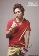 ZE : A / Moon Jun Young / Above-the-knee ・ Costume red ・ yellow ・ Right hand string ・ Face tilted to the left ・ Background grey / 2 ndAlbum "PHOENIX" collection photo