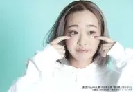 Sena Fujita / Horizontal ・ Bust up ・ Costume white ・ Both hands index finger face ・ Eye view right ・ Background light blue / Theater ToyLateLie 10th Main Performance "You don't know it's a lie"