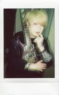 Axkey/AST / Upper Body / Costume Black / Right Facing / Right Hand Guitar / Left Hand Person Index Finger Mouth / Eye Point Left / Raw Cheki