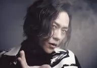 Kenji Hayashino / Horizontal, Face Up, Costume White, Black, Face Facing Right, Right View, Smoke, Background Gray / "GIFT ～ masquerade ～ GODA-NIGHT" Bromide A