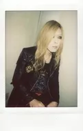 DIAURA / 佳衣 / upper body / sitting / costume black / both thighs / body facing right / background white / raw Cheki