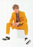 A.B.C-Z / Ryosuke Hashimoto / Whole body, sitting, costume yellow. grey, both hands overlapped, background yellow / Album "CONTINUE?" MV & Jacque-shot & special image off-shot / Official Official photo